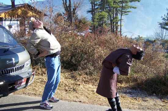 dad-teaching-mr-daza-yoga--thimphu